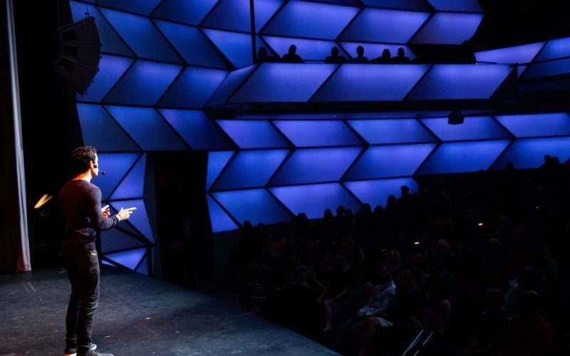 How to Get Paid Speaking Gigs: The Path From Free Stages to Paid Ones